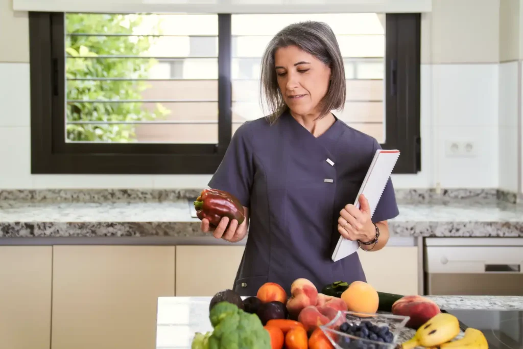 a woman nutritionist holding a bell pepper in her 2023 11 27 05 14 24 utc 1