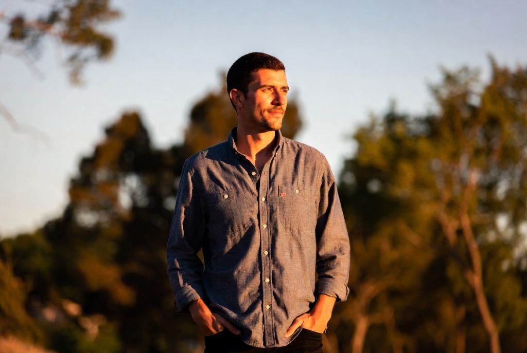 Man standing outdoors in nature during recovery