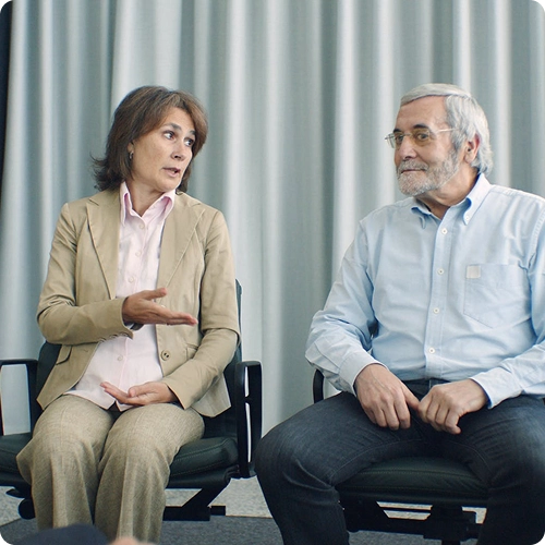Two people seated in conversation during a therapy session
