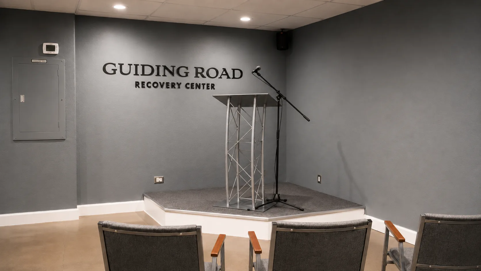 Meeting room with the Guiding Road Recovery Center sign at the Phoenix office
