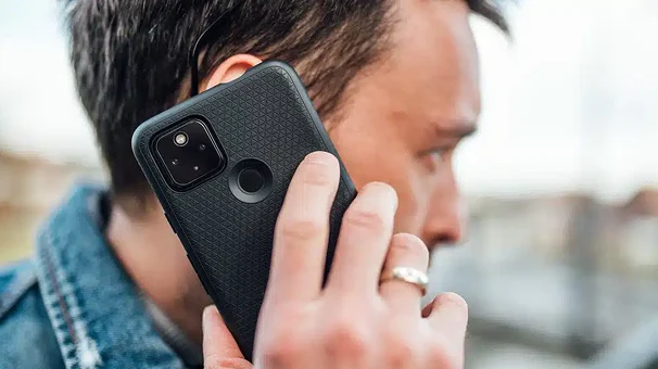 Man talking on a mobile phone outdoors