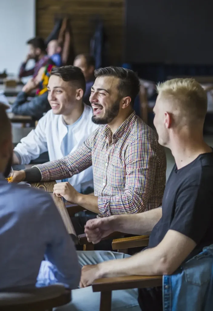 Men supporting each other in group at Guiding Road Recovery Center in Phoenix, Arizona