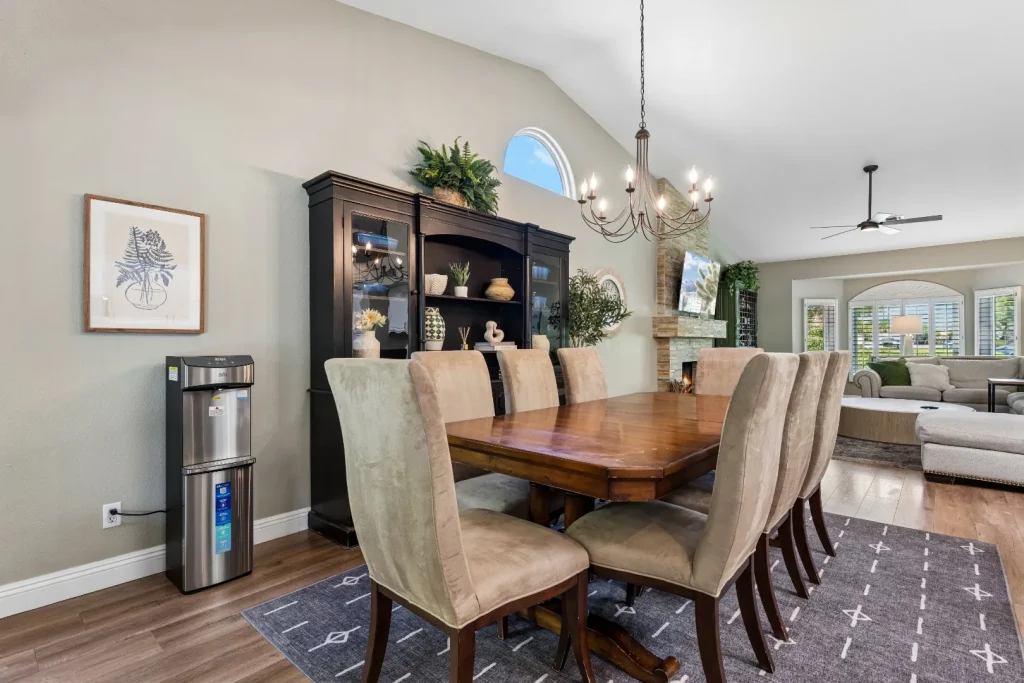 Dining room with a wooden table, chairs, and a chandelier