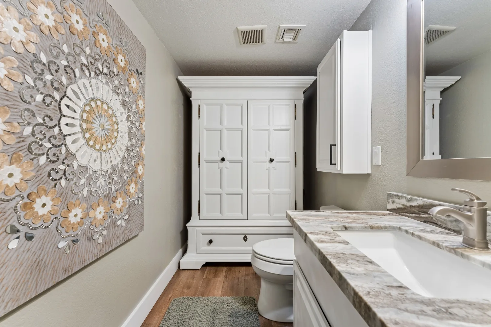 Bathroom vanity with artwork at the Scottsdale mens rehab residence