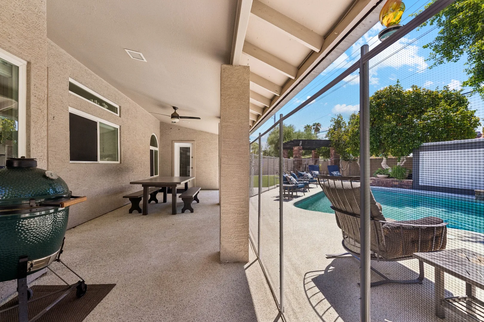 Covered patio overlooking the pool at the Scottsdale mens rehab residence