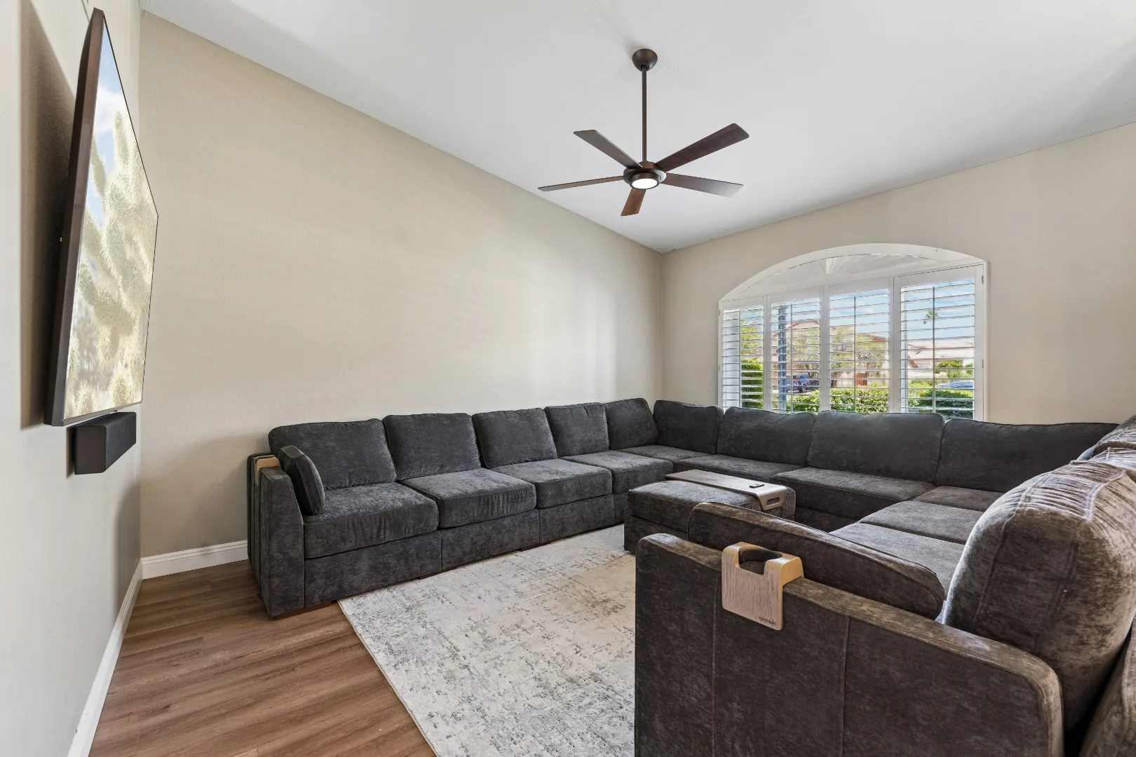 Living room with sectional sofa at the Scottsdale mens rehab residence