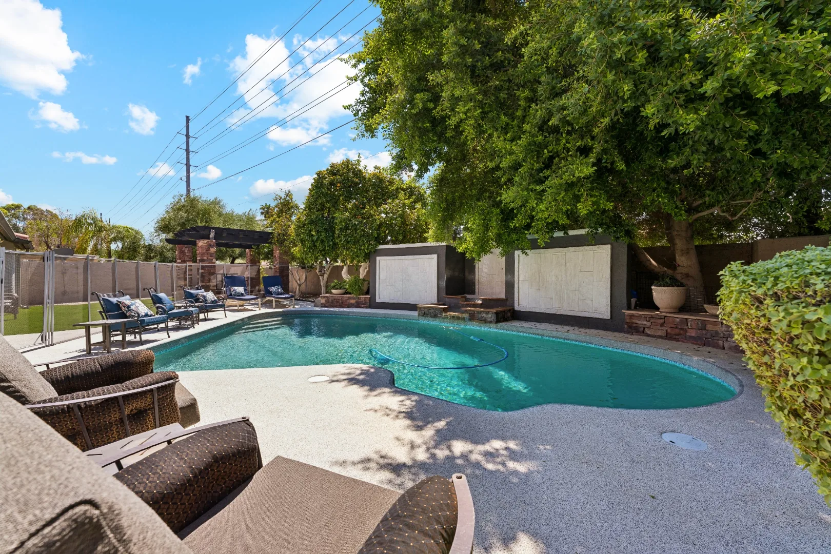 Loungers beside the pool at the Scottsdale mens rehab residence